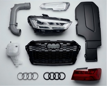 Automotive injection mold parts including water-tank components and mirror housings made by KTM