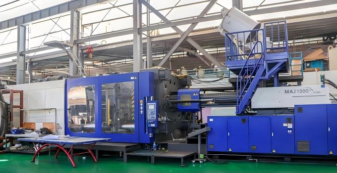 Large 2100T injection molding press in a production workshop